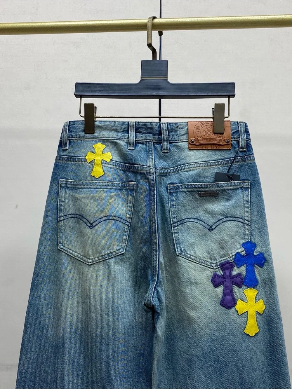 Chrome Hearts Blue Wide-Leg Jeans with Purple & Yellow Cross Appliqués